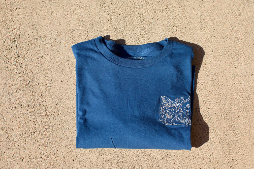 Embroidered stingray design on a navy blue cropped t-shirt with ‘Santa Barbara, CA’ text underneath.