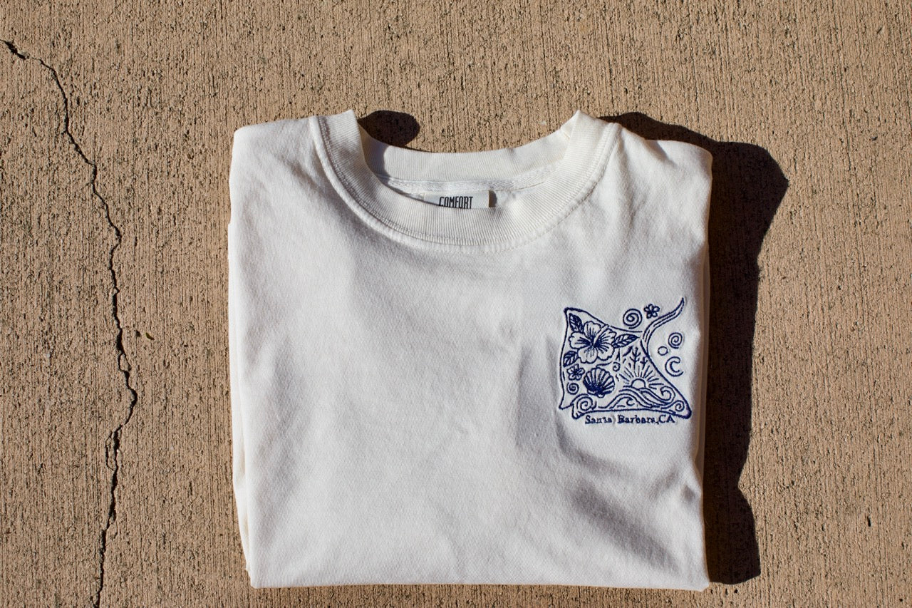 Embroidered stingray design on a cream cropped t-shirt with ‘Santa Barbara, CA’ text underneath.