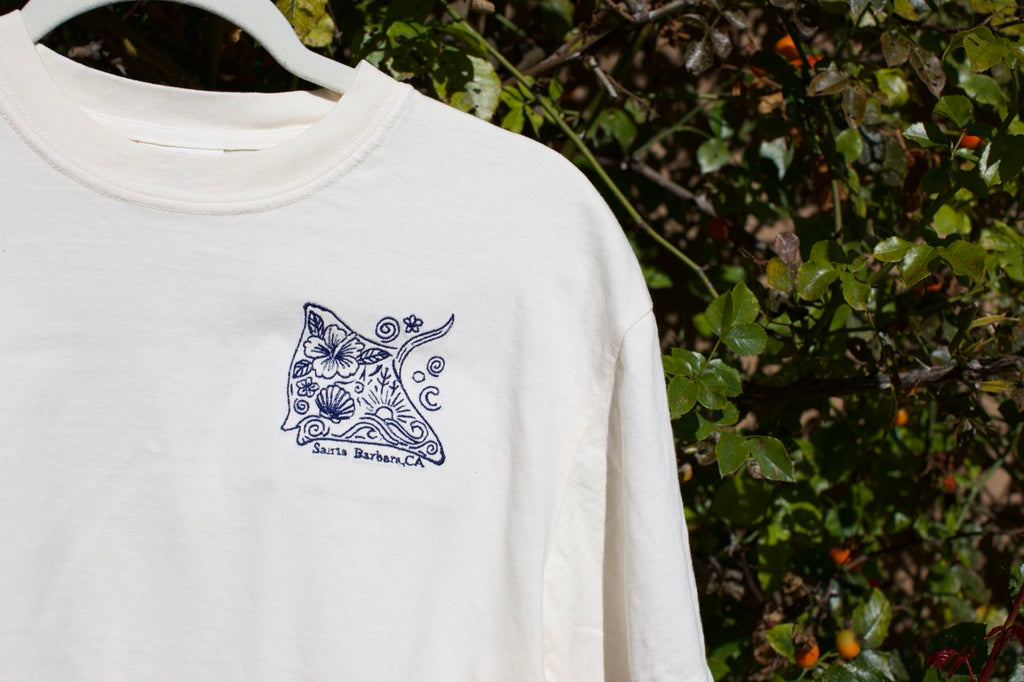 Embroidered stingray design on a cream cropped t-shirt with ‘Santa Barbara, CA’ text underneath.
